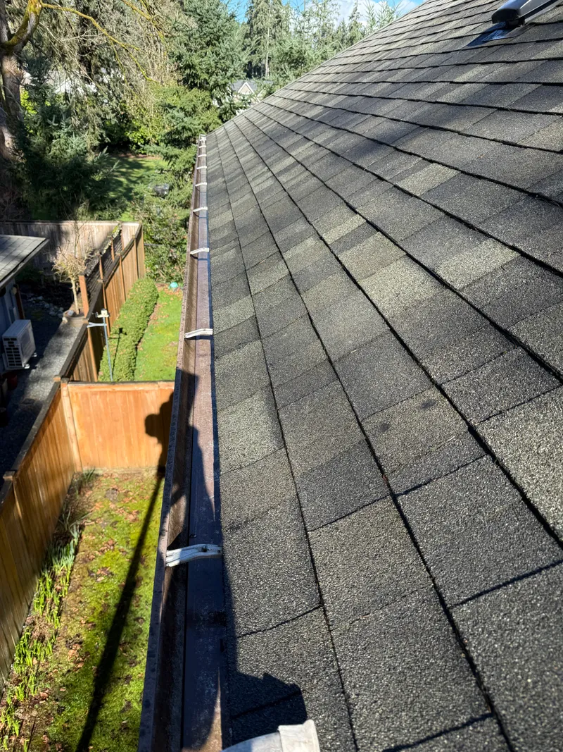 The same gutter after cleaning, cleared down to bare metal